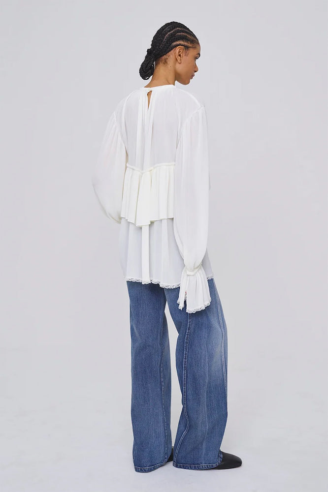
                  
                    SHEER GEORGETTE PLEATED BLOUSE
                  
                