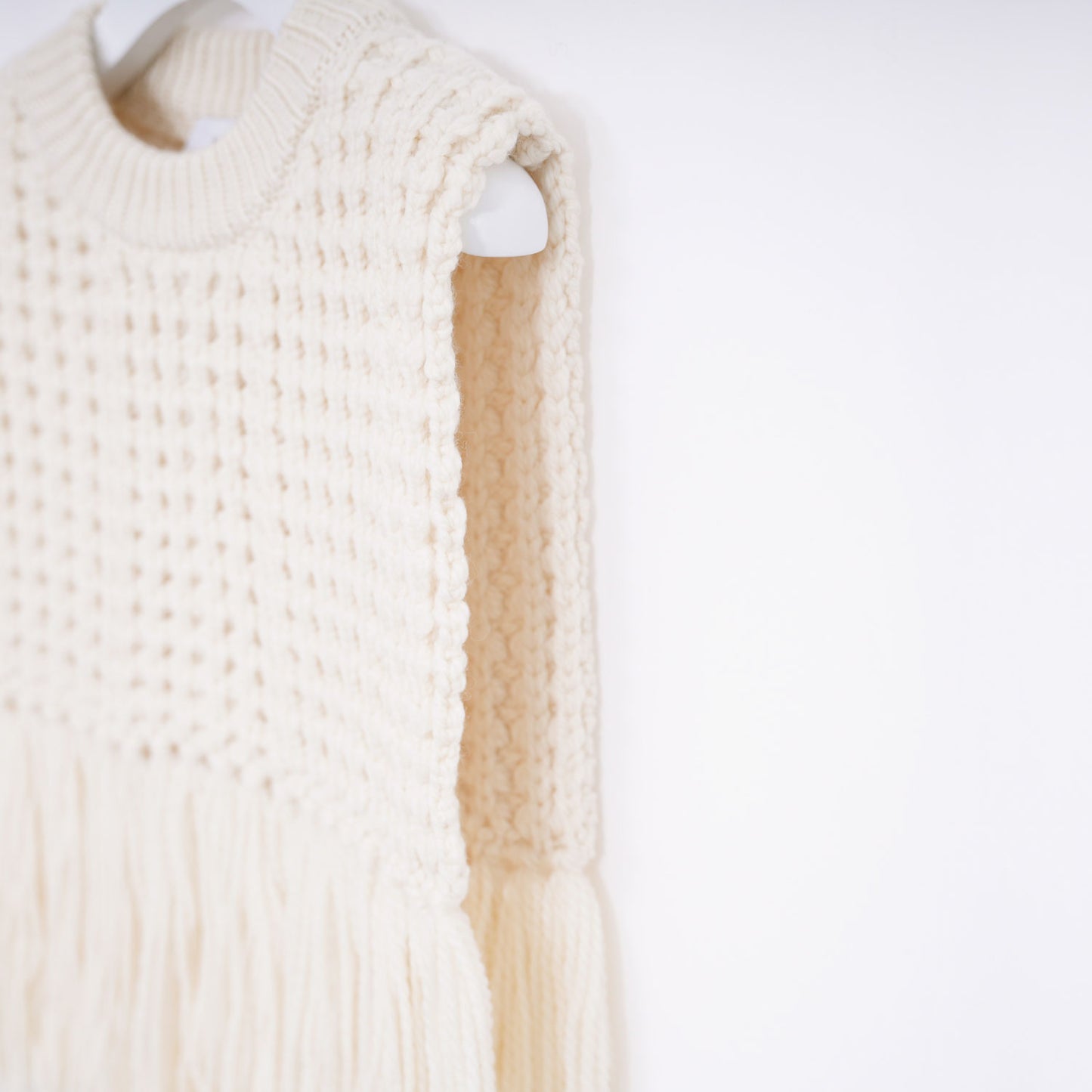 
                  
                    WAFFLE-KNIT SWEATER TOP W/FRINGE
                  
                