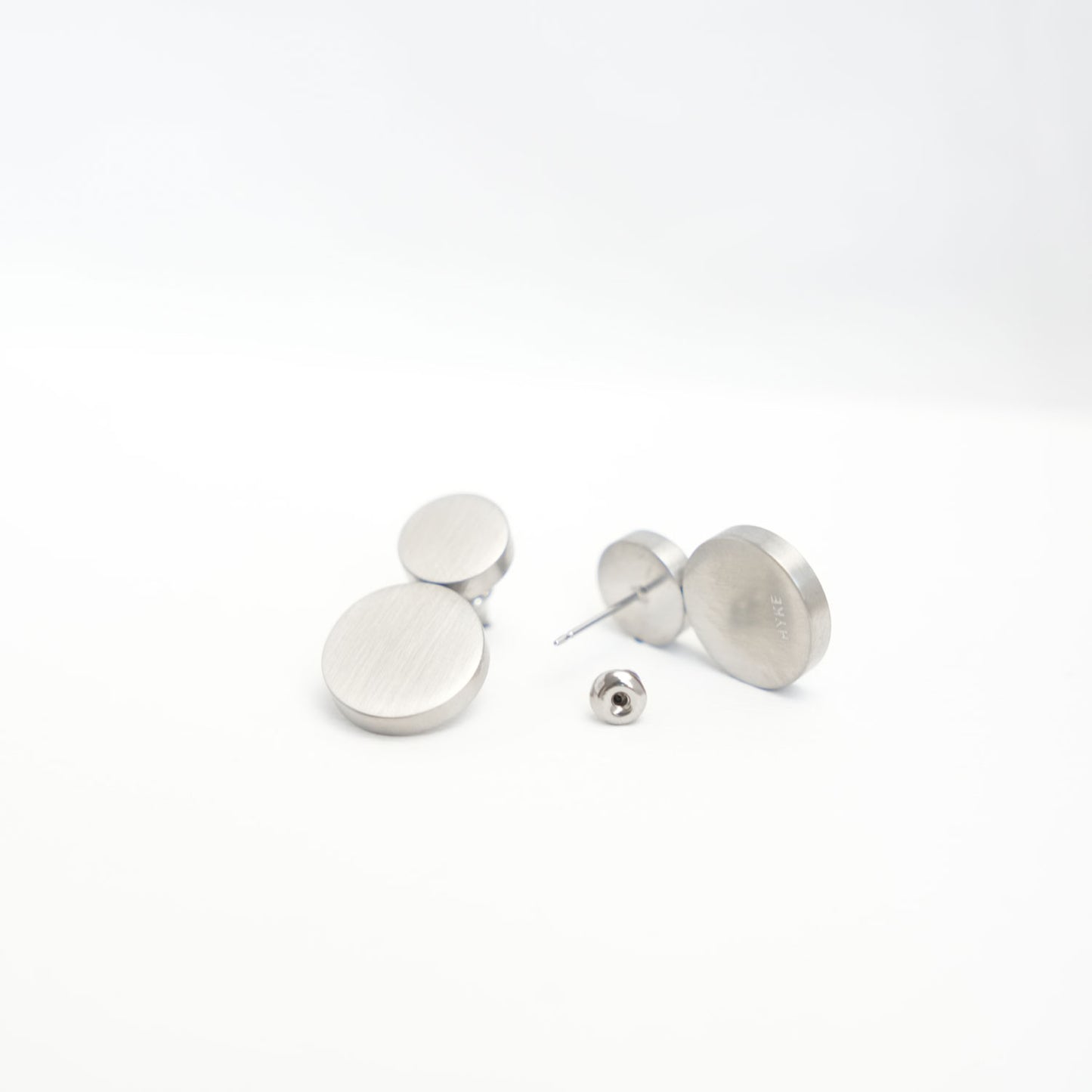 
                  
                    FLAT ROUND EARRINGS
                  
                