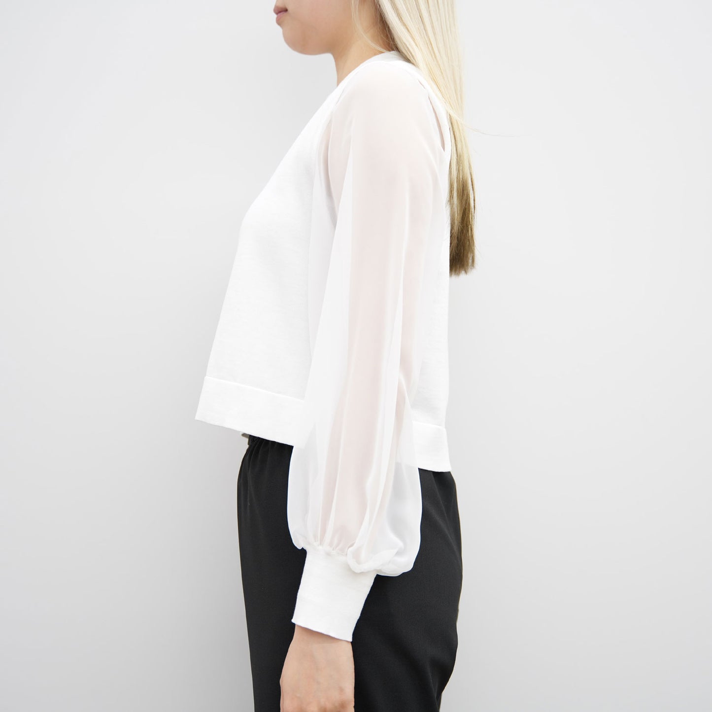
                  
                    CREW NECK CROPPED SWEATER WITH SHEER SLEEVES
                  
                
