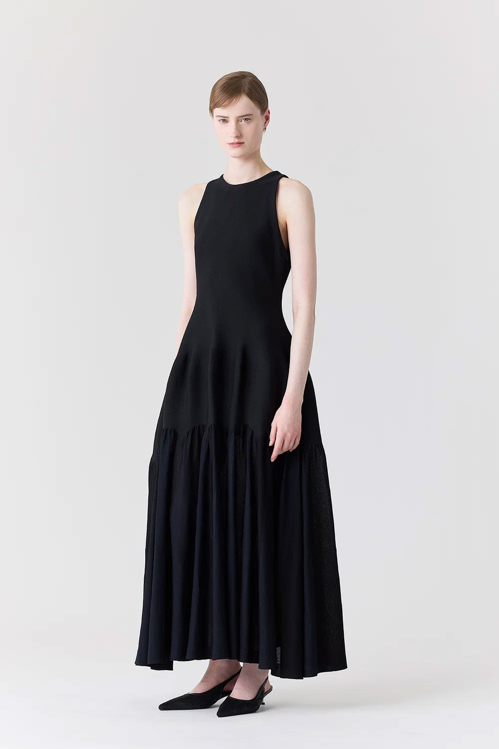 
                  
                    ARCHED SLEEVELESS DRESS
                  
                