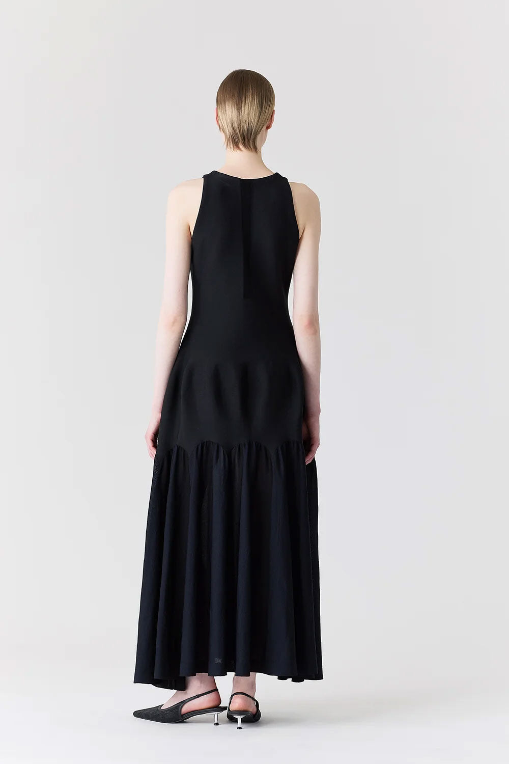 
                  
                    ARCHED SLEEVELESS DRESS
                  
                