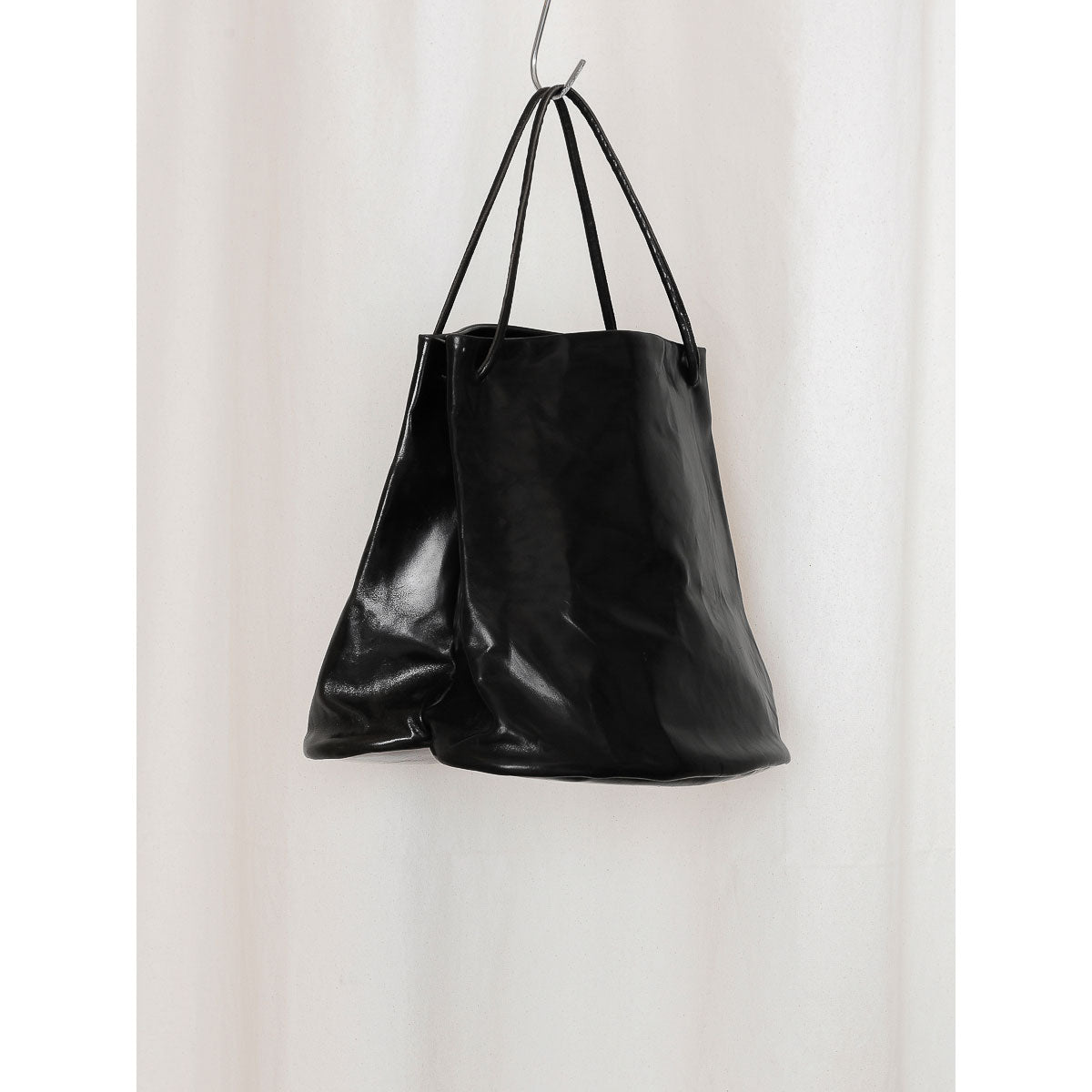 
                  
                    LEATHER HOOF BAG
                  
                