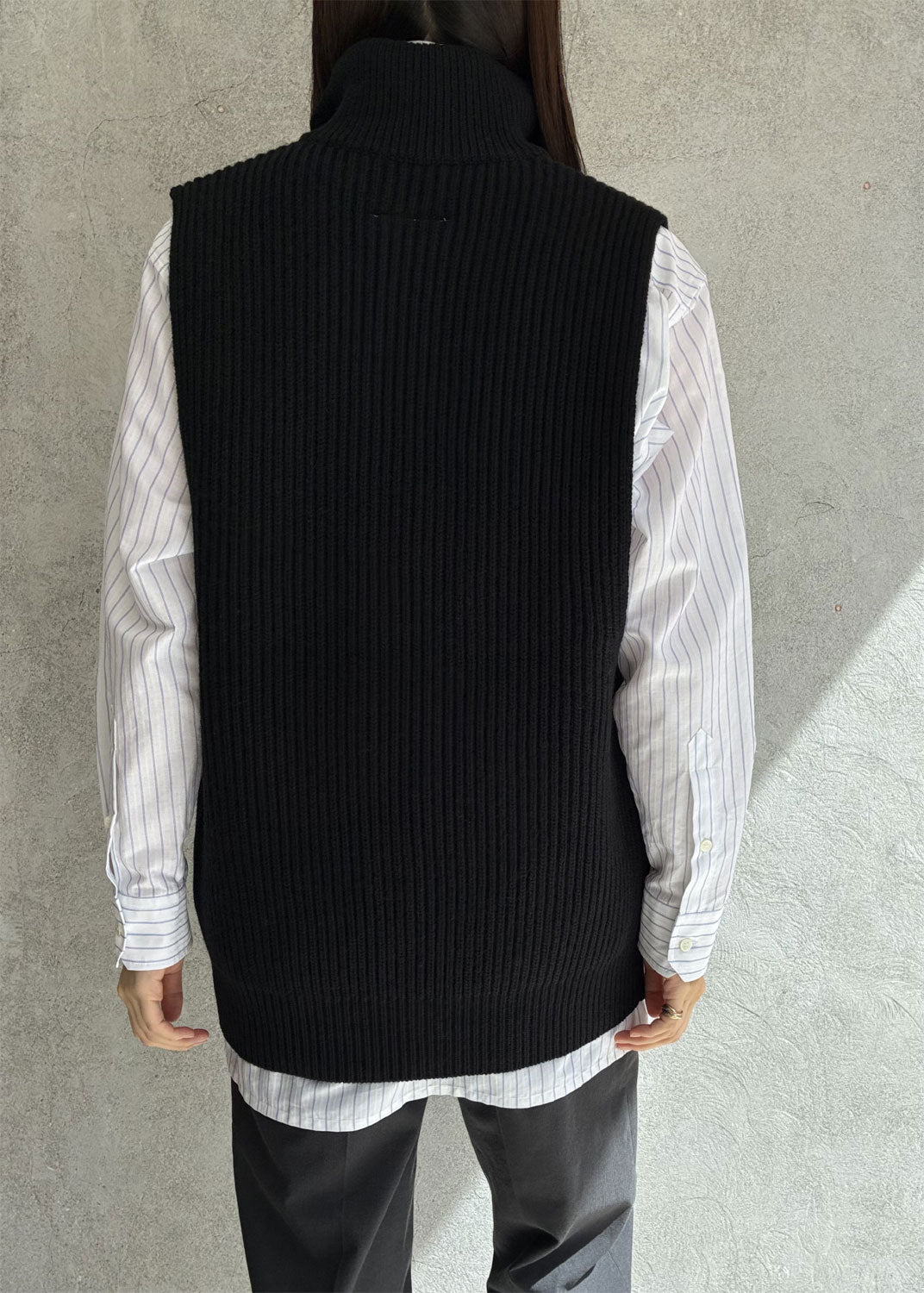 
                  
                    Zip-up knit vest
                  
                