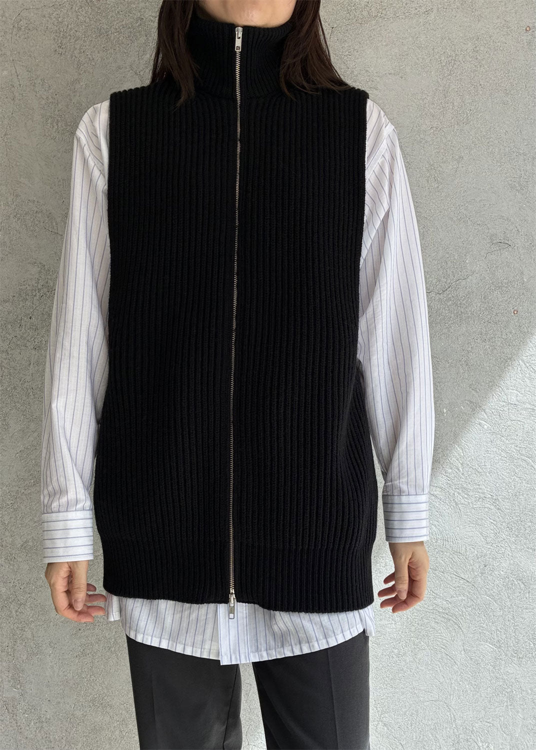 
                  
                    Zip-up knit vest
                  
                