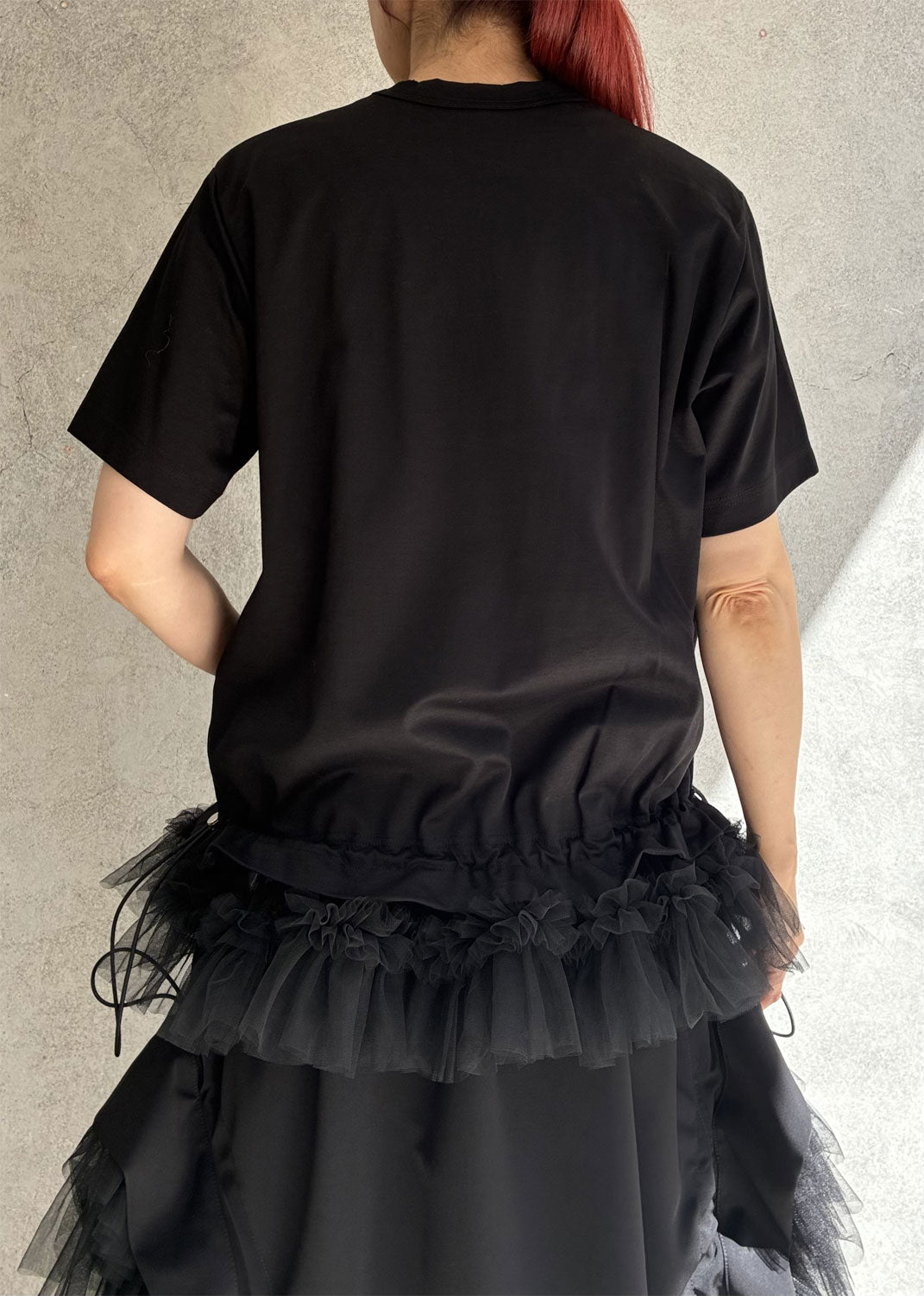 
                  
                    T-shirt with tulle hem
                  
                